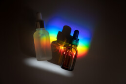 Abstract Cosmetic Laboratory. Bottles Of DDark Amber Glass On A G